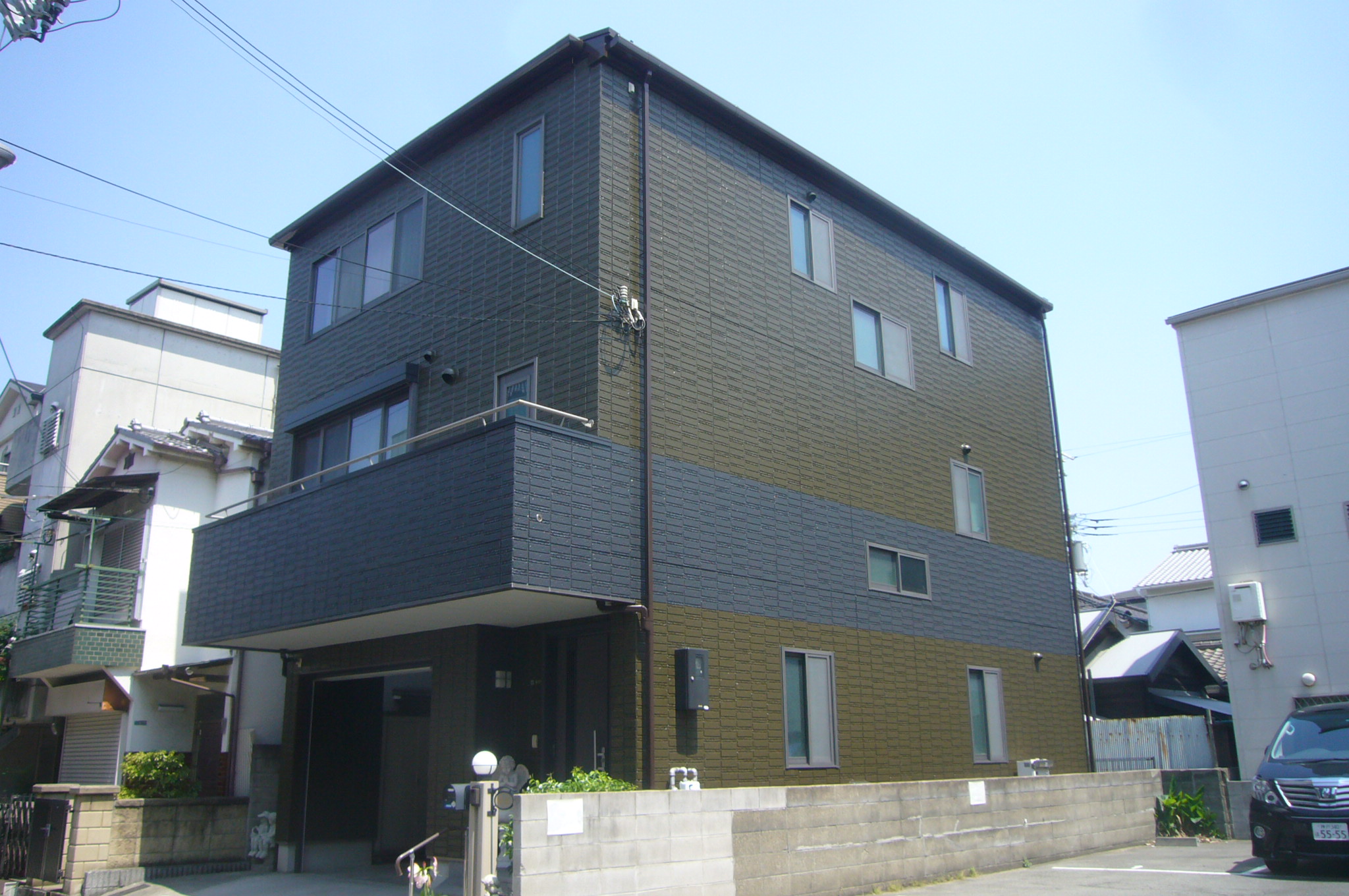大阪市此花区にて外壁塗装工事パーフェクトトップ塗料おしゃれに帯を巻いて塗装